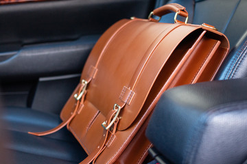 Leather Briefcase in a Luxury Car in the Passenger Seat