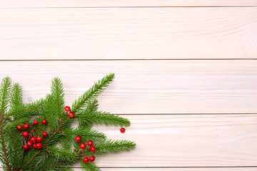 Christmas background. Top view with copy space. fir tree on light wooden background