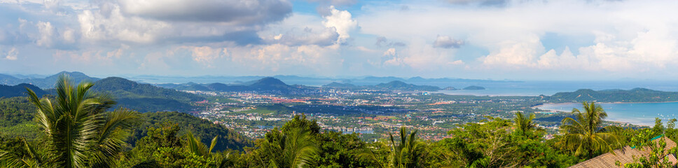 Fototapeta na wymiar Panorama of Phuket from a height, green hills in the middle of the sea