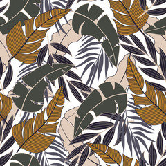 Original seamless tropical pattern with bright plants and leaves on a delicate background. Exotic tropics. Summer.  Modern abstract design for fabric, paper, interior decor.