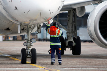 A ground control manager prepares for departing of aircraft from the airport