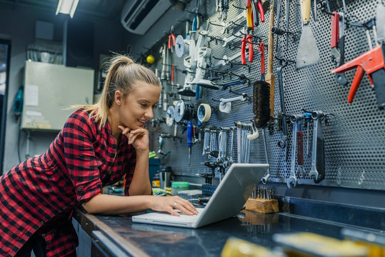 Female mechanic with laptop