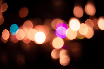 Abstract light colorful bokeh on black background