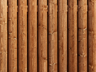rough wooden timber background , brown and orange log wall texture , beam walls close up for building design
