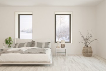 Fototapeta premium Stylish bedroom in white color with winter landscape in window. Scandinavian interior design. 3D illustration