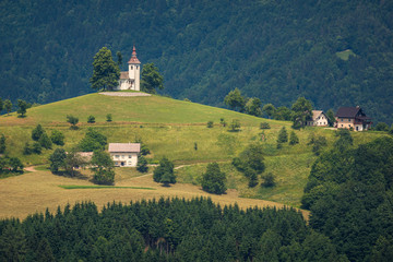 Church on the hill on a beautiful day in Sveti Tomaz, Skofja Loka, Slovenia