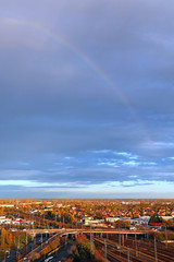 Rainbow over the city in autumn time
