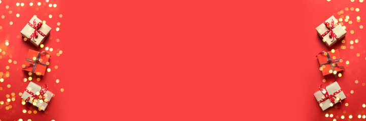 Christmas background with Gifts boxes, red ribbons, golden decorations on red background. Christmas, winter, new year concept. Flat lay, copy space