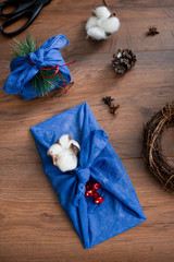 Christmas furoshiki wrapping. Etnical hristmas gift. Zero waste concept