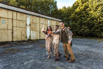 Naklejka premium Zombies go for meat on a stick