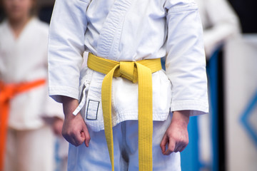 White kimono with a yellow belt