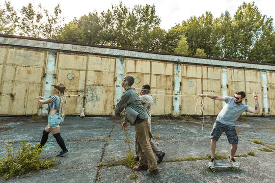 Zombies Go For Meat On A Stick, Zombies In Harness And Skateboarder