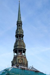 Obraz premium Riga, Latvia, November 2019. The spire of the Cathedral of St. Michael against the backdrop of a cloudy autumn sky.