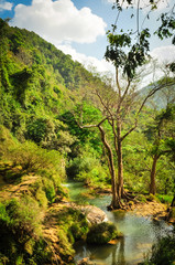Fototapeta na wymiar Aerial Vat spring which flows to Dai Yem (Pink Blouse) waterfall and mountain background in Son La
