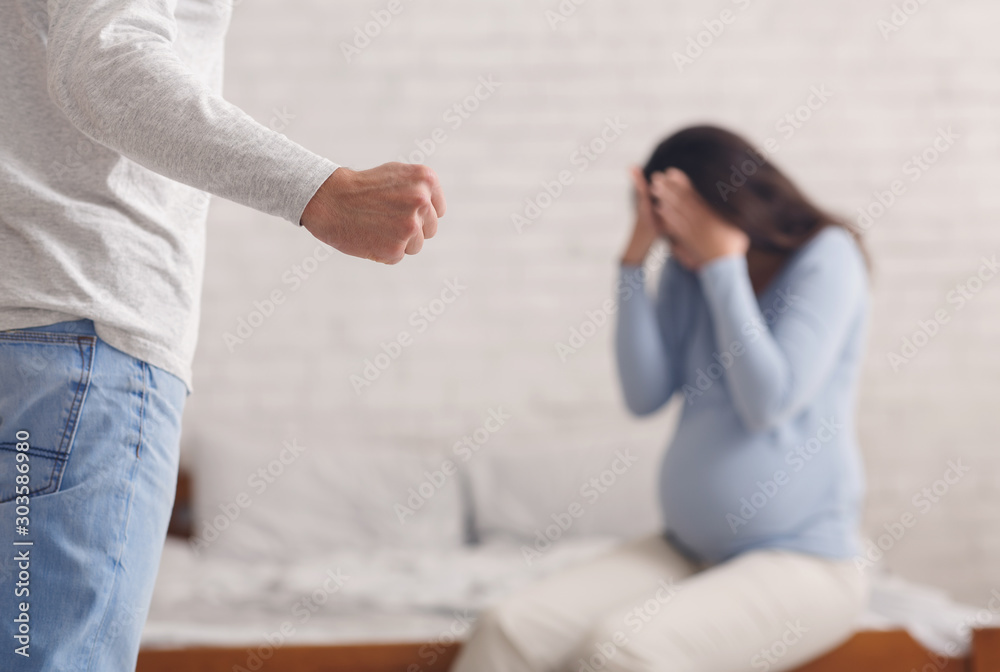 Wall mural pregnant woman suffering from domestic abuse from husband