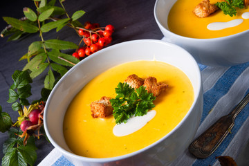 Delicious pumpkin soup with croutons and coconut milk
