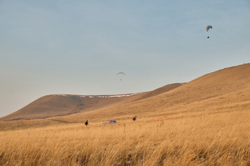 Paragliding in autumn at sunset