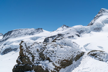 Close-up of winter snowy mountains at nice sunny evening.