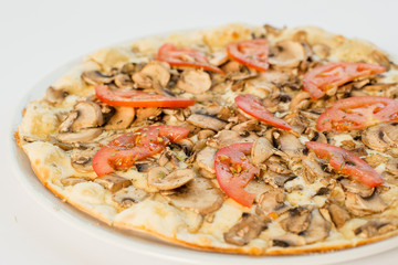vegetarian pizza with champignons and tomatoes