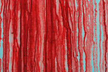 Vertical bloody lines on a white wall. Abstract background