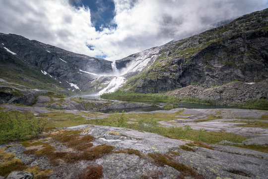 Largest Sotefossen waterfall in Husedalen in cloudy weather Norway