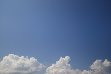 The vast bluesky and clouds for background,Clouds at the bottom of the image with copy space,Concept Brightness of the sky