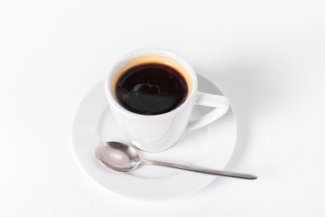 a cup of coffee on a saucer on a white background