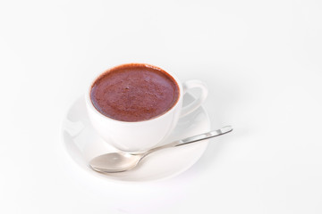cup of hot chocolate against white background
