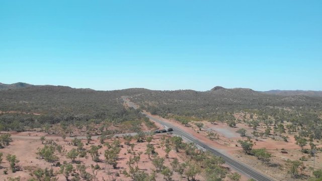 Truck driving in Australian outback filmed by drone