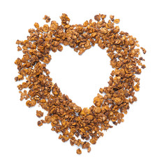 Heart shape made of tasty granola on white background