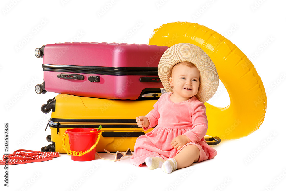 Wall mural Cute baby with suitcases and inflatable ring on white background