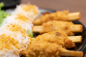 Close-up, Fried Shrimp with Sugar Cane with rice noodle, Vietnam food.