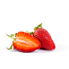 cut strawberries on white background, close-up