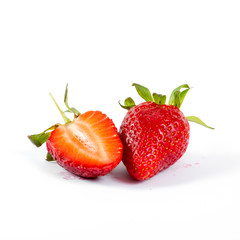 cut strawberries on white background, close-up