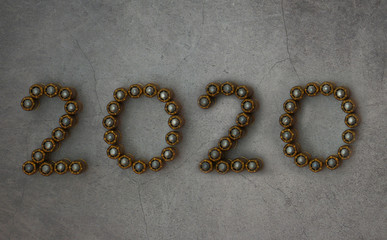 Digit 2020 made of bullets. Cartridges from firearms are laid out in the form of numbers 2020. New Year and Christmas concept