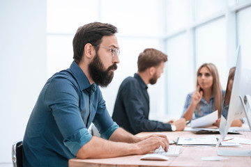 Fototapeta premium close up. serious business man working in the office.