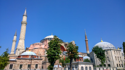 Fototapeta na wymiar Hagia Sophia museum in Istanbul with trees in front, the great national monument of Turkey