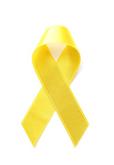 Yellow ribbon on white background. Cancer awareness concept