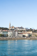 Danube river in Budapest, Hungary. Historical old town in the background with Matthias Church or Fishermans Bastion. Vertical photo of the Hungarian capital city