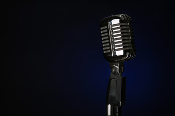 Fototapeta na wymiar Retro microphone on dark background