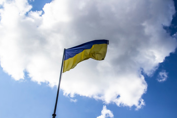 A Ukrainian flag in the blue sky