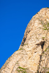 Rock wall at a blue sky