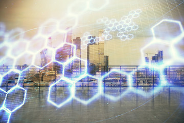 Technology theme hologram with city view from roof background. Double exposure.