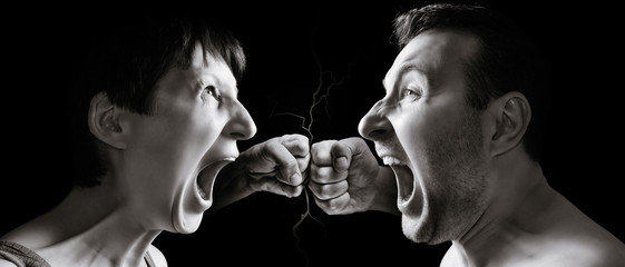 Man and woman yell at each other on black isolated background.
