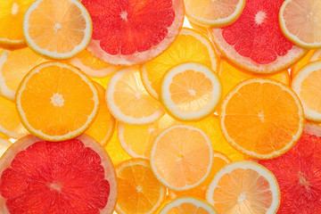 Slices of fresh tangerines and different citrus fruits on white background, top view - Powered by Adobe