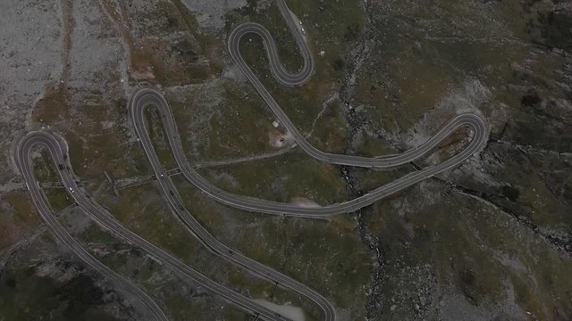 Epic 4k Aerial of the famous winding best driving road through the Transfăgărășan Valley in Romania, Europe.