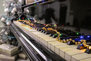 Piano with Christmas decor, closeup