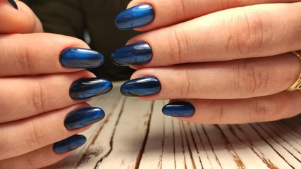 Trendy manicure design on a beautiful background.