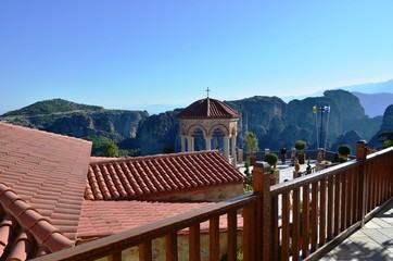 Meteora, Polichni, Greece. 10/24/2019. red roof, fence and gazebo in the famous Greek monasteries of Meteora. temples on the rocks. Place of pilgrimage. beautiful landscape