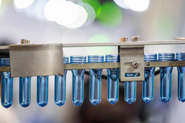 Manufacturing of bottles plastic line, bottle plastic hot blow injection process transportation raw material by automatic conveyor in the factory